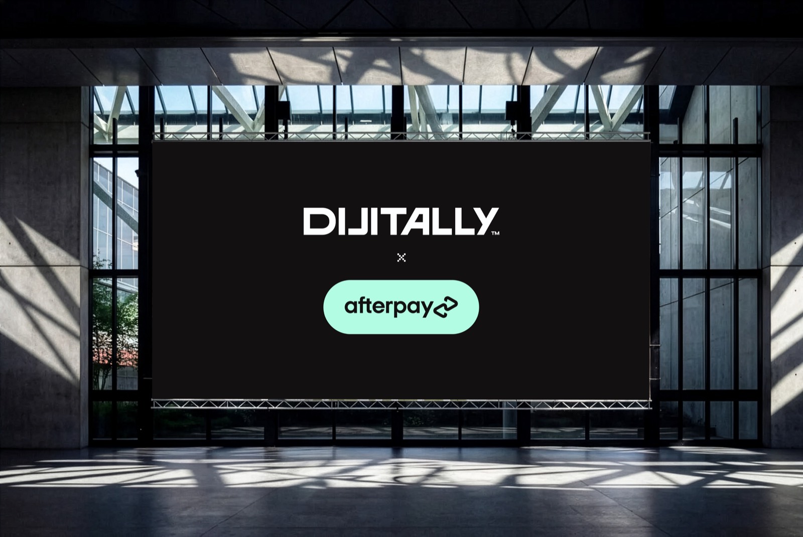 Dijitally and Afterpay logos locked up on the same atrium billboard, stacked the other way
