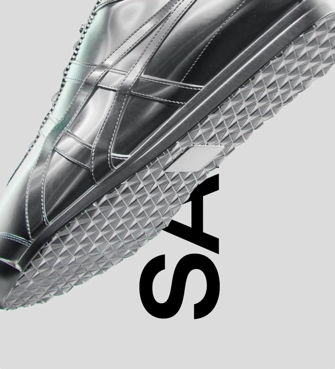 Chrome sneaker sole in close up against the campaign SALE lettering