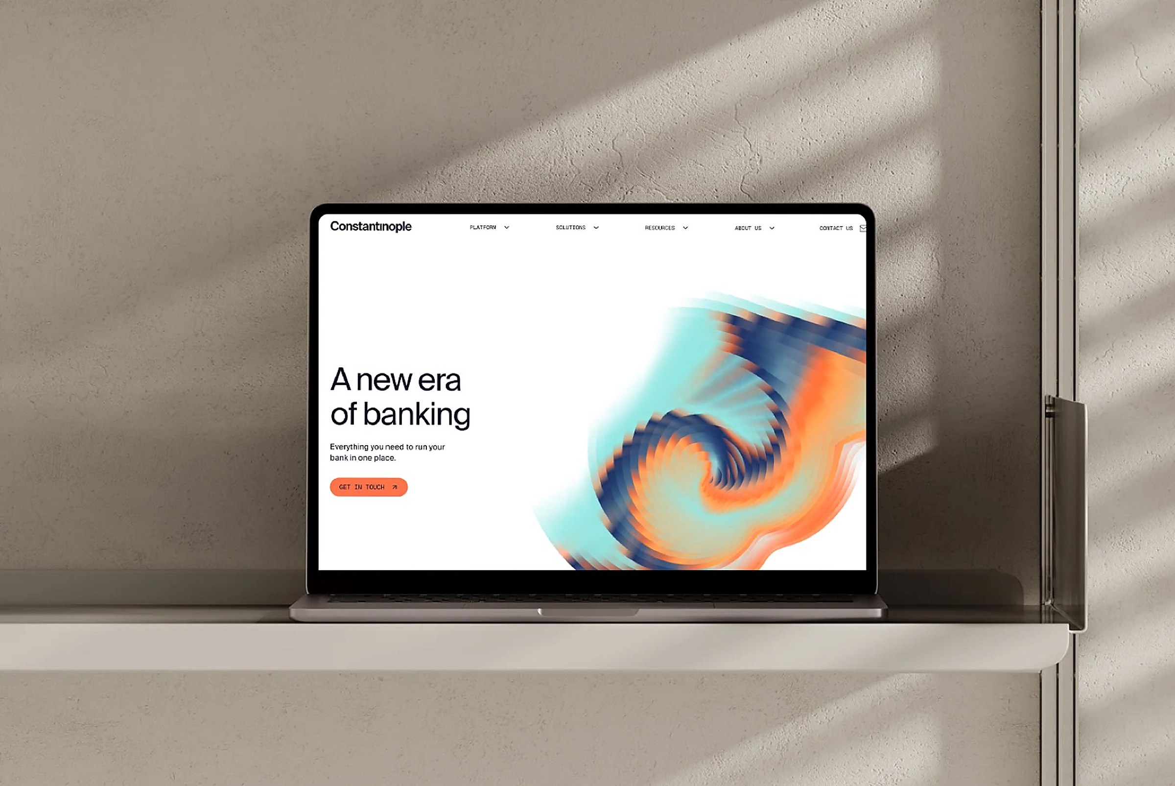 The Constantinople site on a laptop, headline A new era of banking beside a swirled colour render