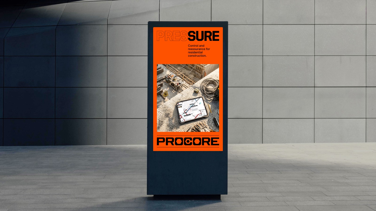 The same Procore Pressure artwork on a free-standing digital signage panel
